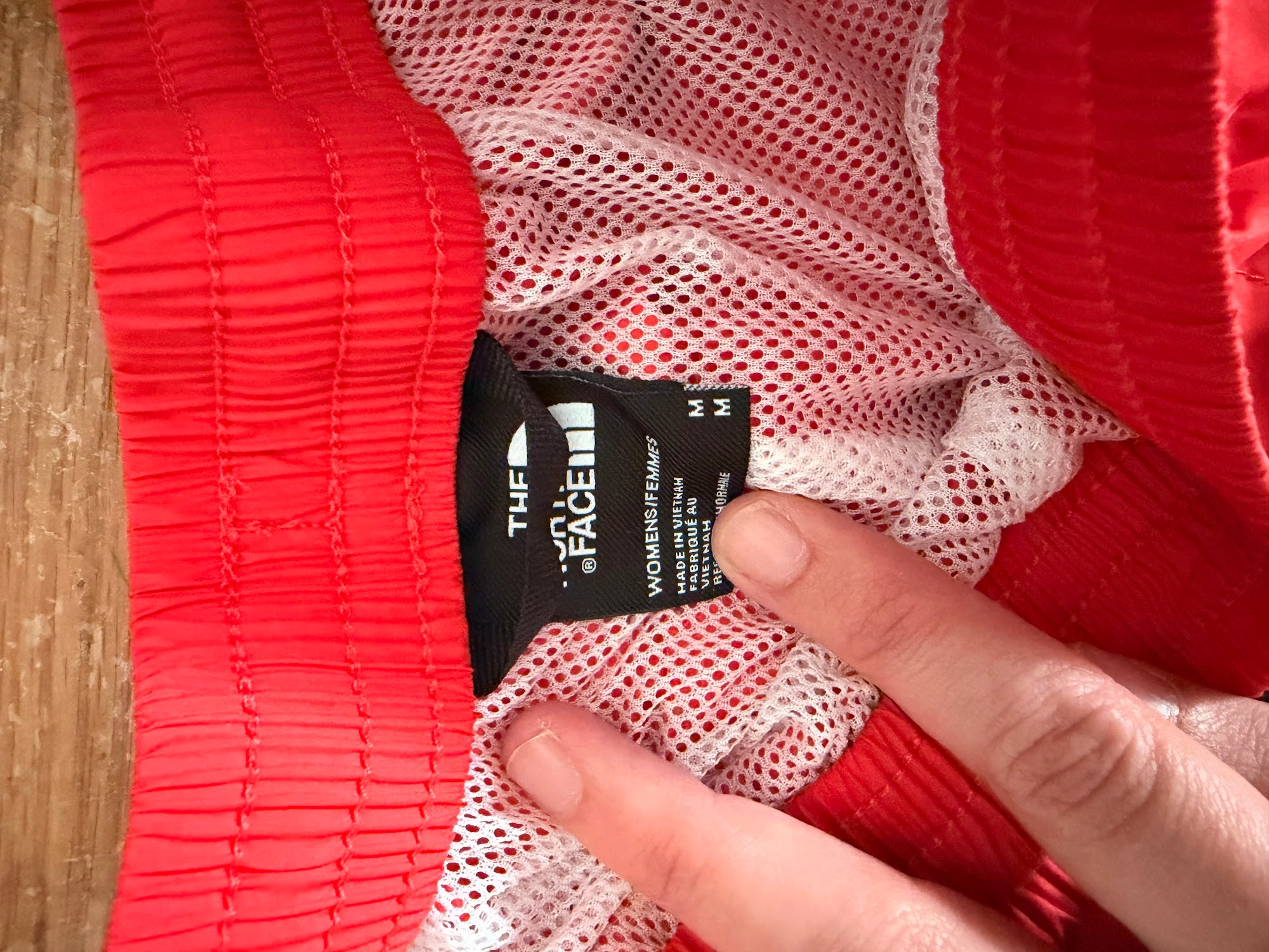 The North Face brand tag, women's size M