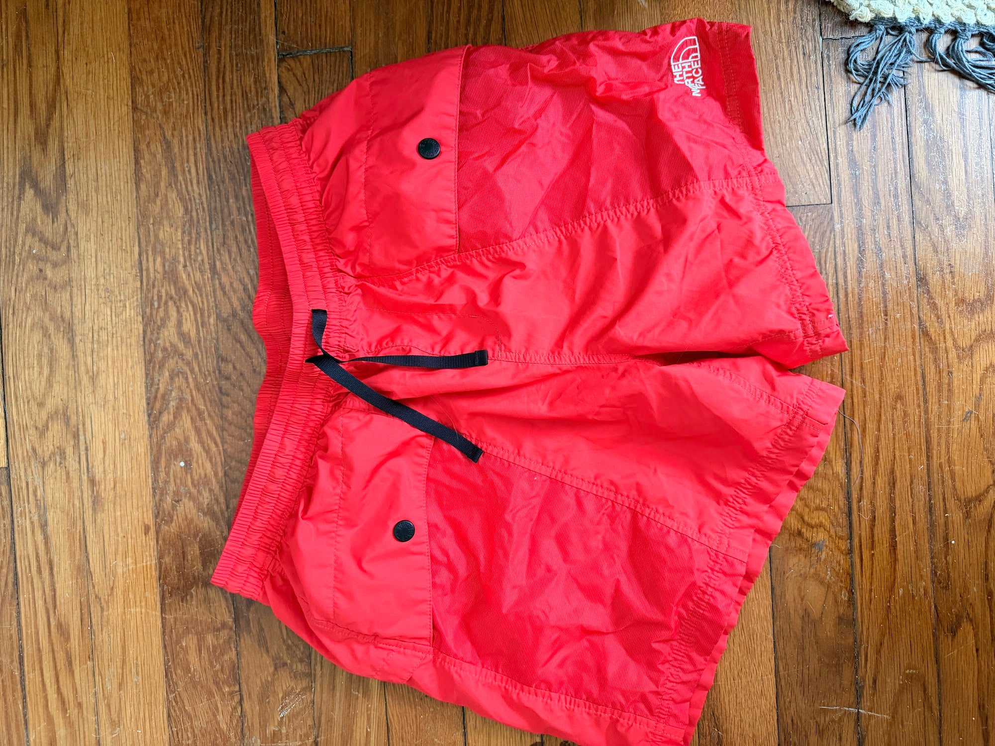 The North Face coral athletic shorts, front view